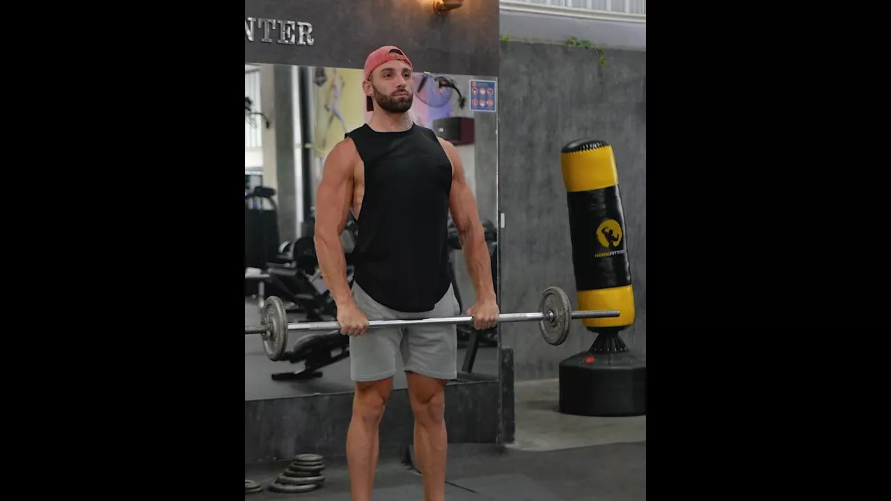 Standing Barbell Front Raise exercise